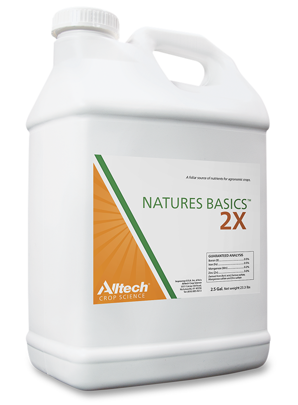 A white plastic jug labeled "Natures Basics 2X" from Alltech Crop Science. The label features a green and orange design, with text highlighting it as a source of nutrients for agronomic crops. The jug holds 2.5 gallons and includes a section for guaranteed analysis.